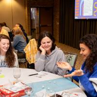 three people at luncheon table photo 2